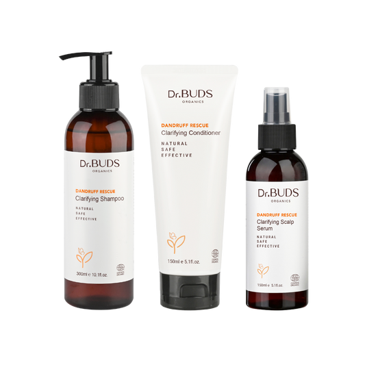 A set of Dr Buds Organics Hair care products including shampoo, conditioner, and scalp serum, labeled for dandruff management.
